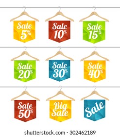 Vector illustration sale labels on hangers set. The concept of price reduction, discount