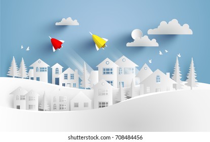 vector illustration scenery. rockets glide over small town. paper art design