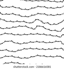 Vector illustration. Seamless abstract hand-drawn pattern. Grey, black and white monochrome spotted background. Halftone dotted wave.