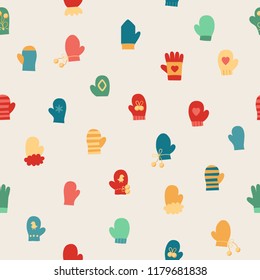 Vector illustration: seamless background with winter clothes: blue, red and yellow gloves and mittens with different ornaments. Design for Xmas 
 fabrics, wallpapers  isolated on creamy background