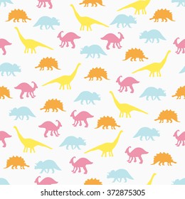 Vector illustration. Seamless ornament background made of silhouettes of dinosaurs of different species on a light background.