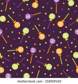 A vector illustration seamless pattern background of halloween trick or treat candies. Bright candies and sweets in the traditional colors of Halloween