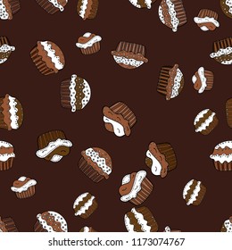 Vector illustration. Seamless pattern of cupcakes on a brown, white and black background. Wrapping paper.