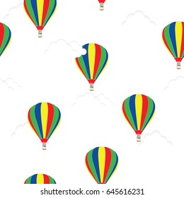 Vector illustration seamless pattern hot air balloons in the sky with clouds. Colorful striped hot air balloon. Background for textile, ornament paper, wallpaper or wrapping paper