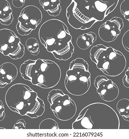 Vector illustration. Seamless pattern of large and small human skulls, hand drawn. Repetitive wallpaper of bones. Creepy evil Halloween background. The day of the Dead. Design of wrapping, gift paper.