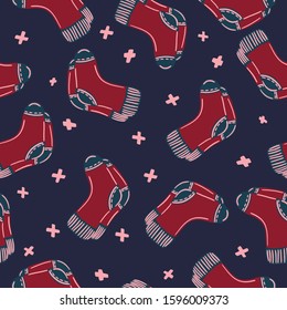 Vector illustration of a seamless pattern made in hand style - knitted socks. Bright colorful style, great eleme for your design, textile or printing.