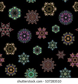 Vector illustration. Seamless pattern on black background. Simple snowflakes seamless pattern, floral elements, decorative ornament. Arab, Asian, ottoman motifs in neutral, blue and green colors.
