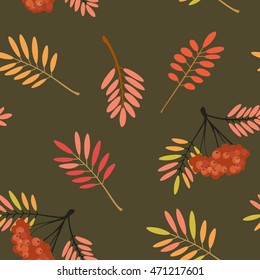 Vector illustration. Seamless pattern with a picture of leaves and bunches of rowan berries. Backdrop. The background. Wallpapers with leafy pattern.