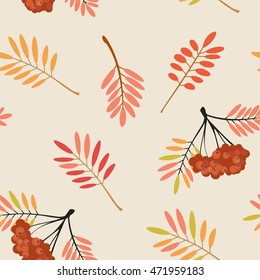 Vector illustration. Seamless pattern with a picture of leaves and bunches of rowan berries. Backdrop. The background. Wallpapers with leafy pattern.