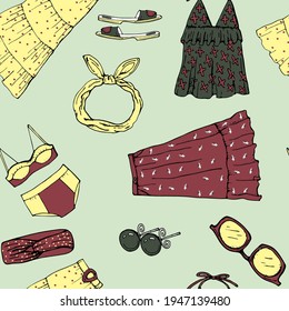 vector illustration seamless pattern ,set with women things and accessories in yellow, green and burgundy colors on a gray-green background, doodle