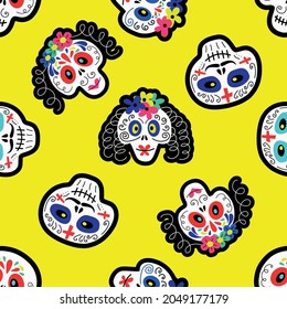 Vector illustration of seamless pattern with various multicolored traditional Mexican calaveras or sugar skulls for Day of Dead celebration on yellow background