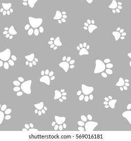 Vector illustration of a seamless pattern of white wild animal paws on a gray background