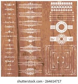 Vector illustration of a set of calligraphic dividers and floral page elements, corners and frames for scrapbook and other designs on wood background