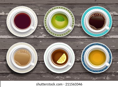 Vector illustration. Set of coffee and tea cups on a wooden table. Top view