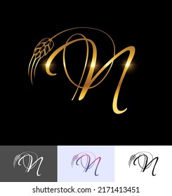 Un conjunto de ilustraciones vectoriales Monograma de Trigo Dorado Letra inicial N en fondo negro con efecto de brillo dorado