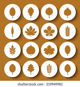 Vector illustration: set of sixteen circle white 3d badges with yellow silhouettes of different tree leaves isolated on mustard background