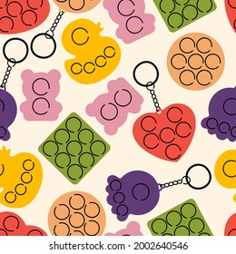 Vector illustration set of trendy sensory pop it fidgets. Rainbow antistress toys with trinket. Seamless pattern