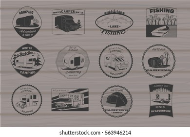 Vector illustration of Set vintage camping and outdoor adventure emblems, logos and badges. Camping equipment. Camp trailer in the forest on wood background.