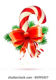 Vector illustration of shiny red Christmas candy cane with bow and evergreen branches