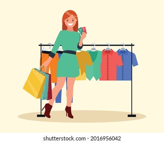 A vector illustration of shopping woman inside the clothing store holding a credit card. Vector illustration in a flat style.