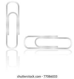 Vector illustration showing a couple of paper clips reflected on a white background