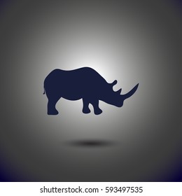 Vector illustration of a silhouette of a rhino standing