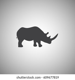 Vector illustration of a silhouette of a rhino standing. Rhinoceros side view profile.