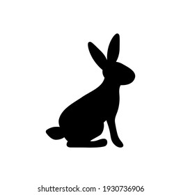 Ilustración vectorial de un conejo sentado. Silueta negra de liebre sobre fondo blanco
