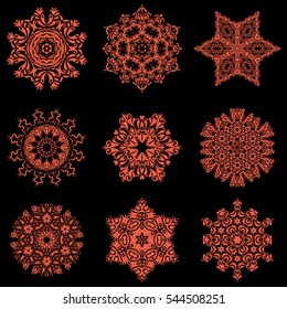 Vector illustration. Vector sketch on black background for Christmas. Decorative orange snowflakes set.