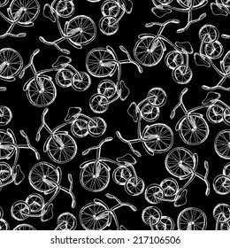 Vector illustration. Sketch. Seamless pattern of children's bicycles. ?lack and white