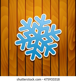 Vector illustration with snowflake on wood background.