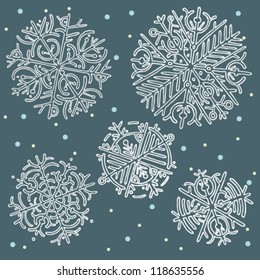 Vector illustration of snowflakes set on blue background.
