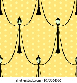 Vector illustration, soft seamless pattern in vintage style, cartoon black streetlight on yellow dotted background