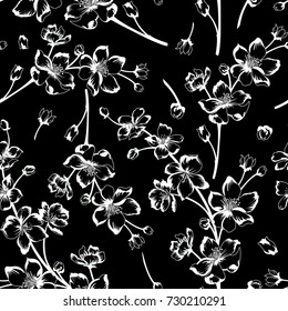 Vector illustration of spring blossom branches. White and black flowers and stems on black background. Seamless pattern.