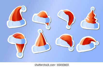 Vector illustration of stickers santa hats on a blue background