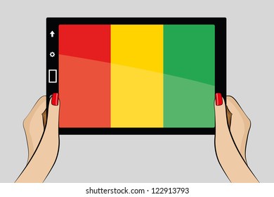 A vector illustration of a tablet computer with the flag of Guinea