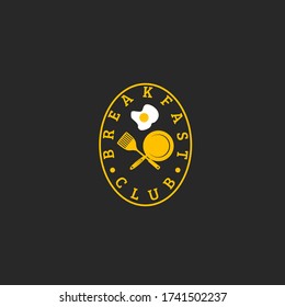 Vector illustration of text with frying pan, spatula and frying egg in oval circle isolated on black background fit for steak restaurant logo 