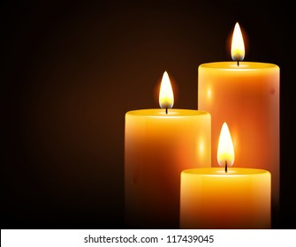 Vector illustration of three yellow candles on dark background