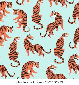 Vector illustration of tigers on blue background. Trendy seamless pattern that can be used for wrapping, wallpaper, fabric, texture and interior design.