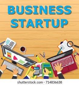 Vector illustration. Top view business start up concept. Working desk from above view with businessmen hands working on laptops and papers to make business start up strategy. 
