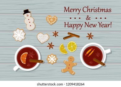 Vector illustration of two cups of mulled wine and gingirbread on table