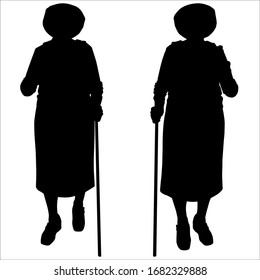 Vector Illustration Two Woman Silhouettes In Motion. Front View, Full Face. Older Women In Hats And With Backpacks On Backs. Grandmothers On A Walk In Nature. In Their Hands Hold Sticks For Walking.