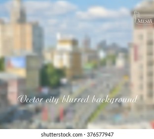 Vector illustration of urban landscape for design. Central street of the city. City blurred background. Vector mesh blurred background. Abstract blurred buildings and street.