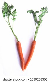Vector illustration of a "V" shaped out of two carrots, indicating for example veganism or vegetarian foods. 