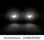 Vector illustration of white car headlights shining from darkness background, lights template. Isolated on black background