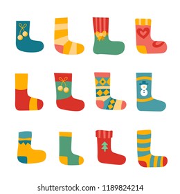 Vector illustration: winter foot clothes set of 12 blue, red and yellow woolen socks isolated on white background. Decorative elements for Christmas greeting cards, fabrics, wallpapers, wrapping paper