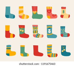 Vector illustration: winter foot clothes: set of 15 blue, red and yellow woolen socks isolated on white background. Decorative elements for Christmas greeting cards, fabrics, wallpaper, wrapping paper