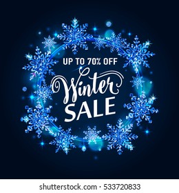 Vector illustration of winter sale poster template with lettering text sign in white square frame and gold glittering snowflakes