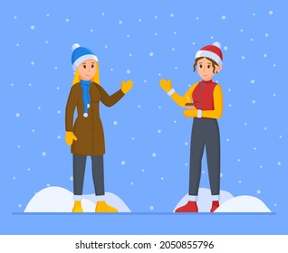 Vektorgrafik von Winterfrauen. Zwei Mädchen spielen auf der Straße Schneebälle. 