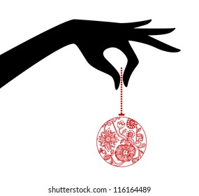 Vector illustration of Woman hand holding xmas ball